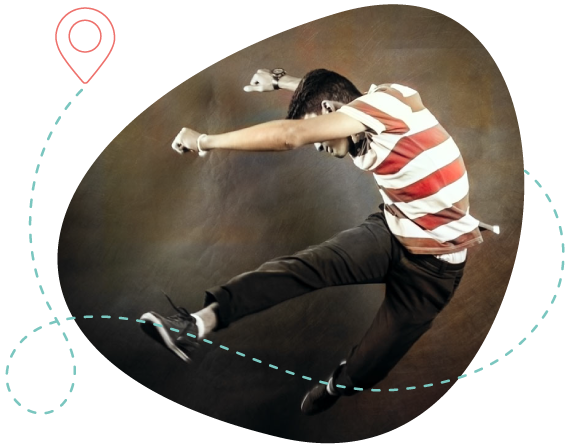 Young man jumping with a strained expression, framed by a dotted path, representing cultural shock and migratory adaptation.