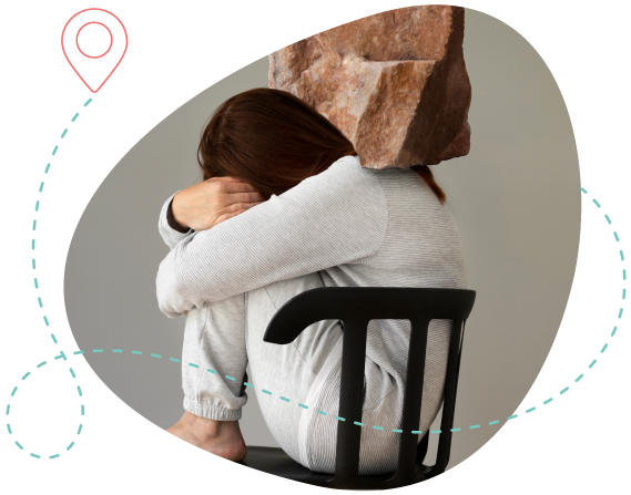 A person curled up with a heavy rock on their back, symbolizing the emotional weight of severe depression.